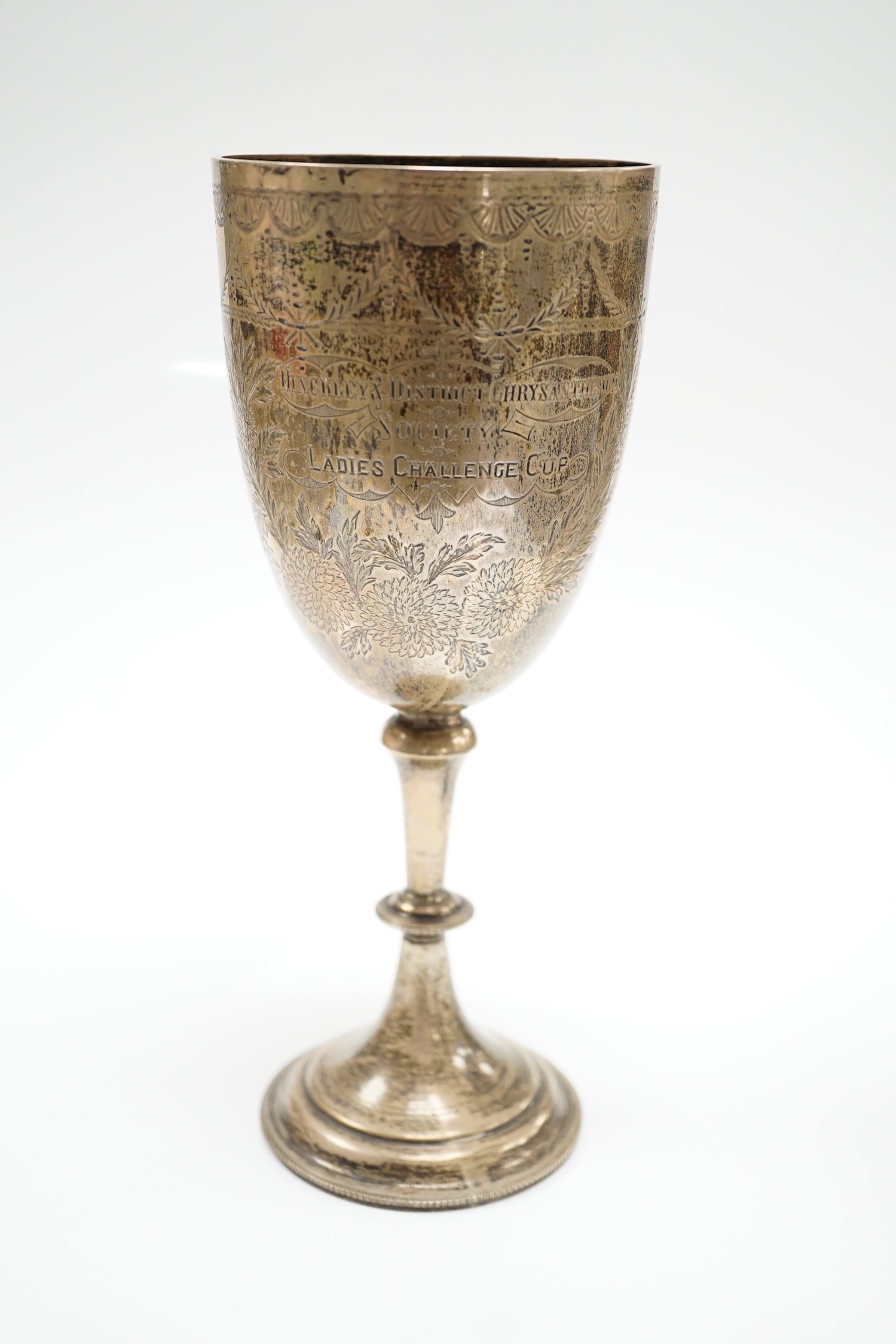 A late Victorian engraved silver presentation goblet, possible Charles Boyton, London, 1890, 23cm, 7.8oz.